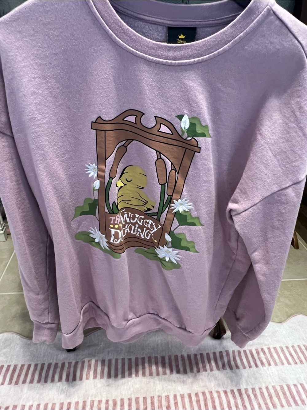 Disney Tangled Snuggly Duckling Logo Lilac Sweater
